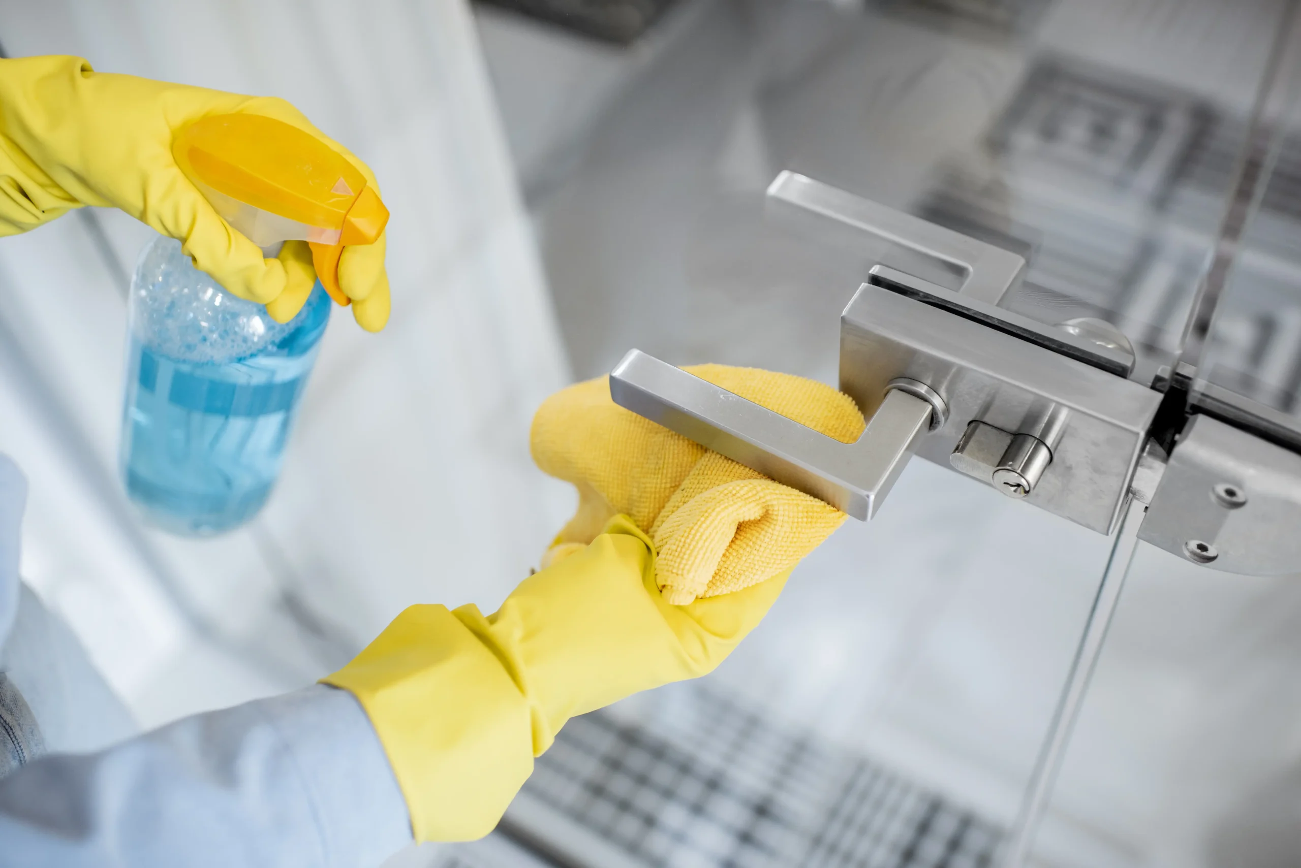 woman-cleaning-door-handle-at-home-2026-01-09-00-42-52-utc